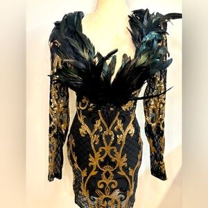 Black and gold sequin dress with feathers